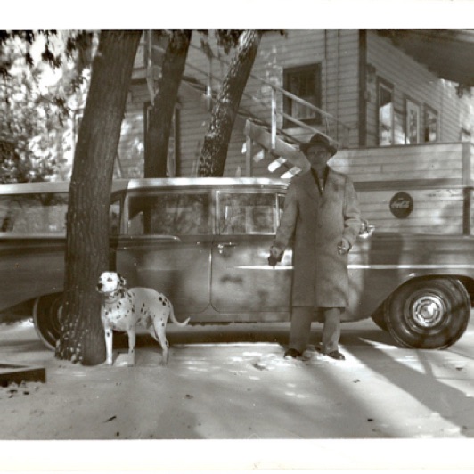 Here's a shot of Mr. Pfaff with his dog. He was  3 owners back. Notice the stairs going up the front of the lodge.