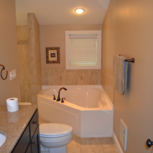 The master bath has a corner tub, separate shower and 60 inch vanity.
